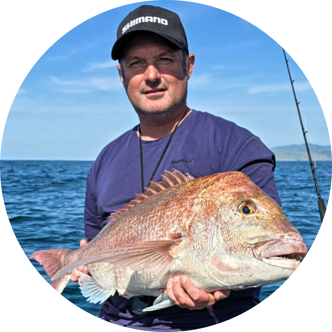 profile picture of captain gene holding a snapper